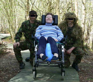 Two members of 34 Sqn with sanctuary owner Rosie